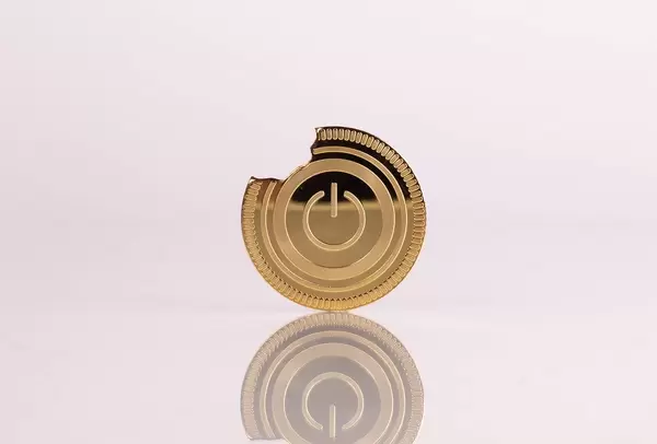 Broken golden coin with power button on white background
