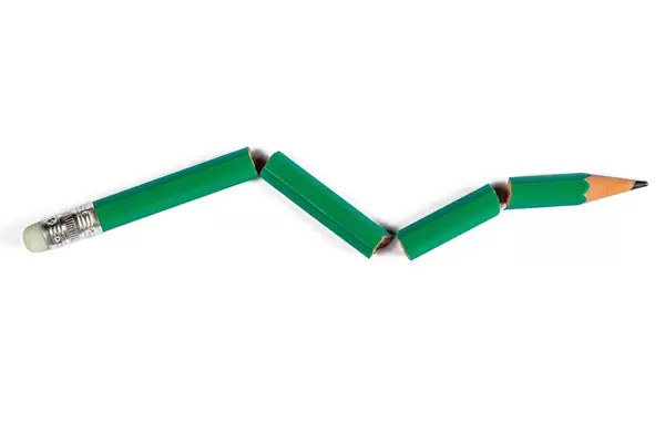 Broken pencil on white background