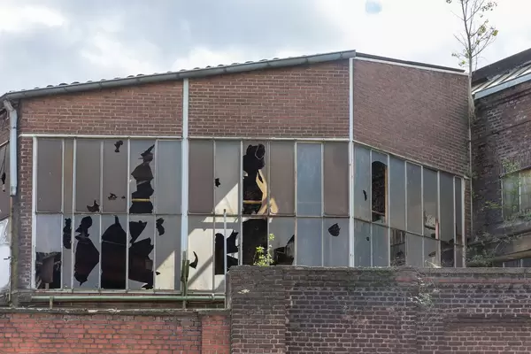 Broken windows of an old factory building