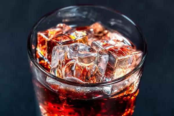 Brown drink with ice