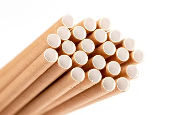 Brown straws for a cocktail, close-up