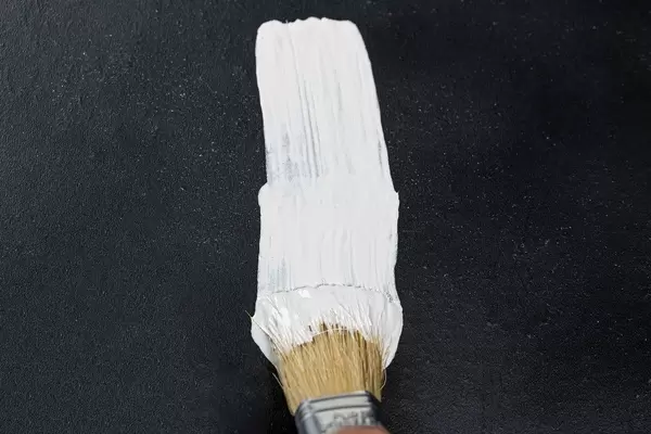 Brush in white paint large background. The concept of repair