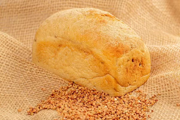 Buckwheat bread and buckwheat on burlap
