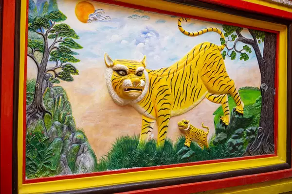Buddhist 3D Wall Art of a Tiger in Nature with Trees in Quan Am Pagoda in District 5 of Ho Chi Minh City, Vietnam