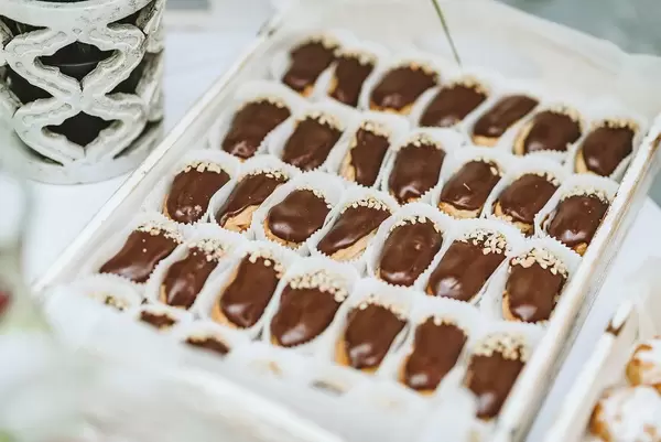 Bunch of ecler pastry covered with chocolate stacked (Flip 2019)