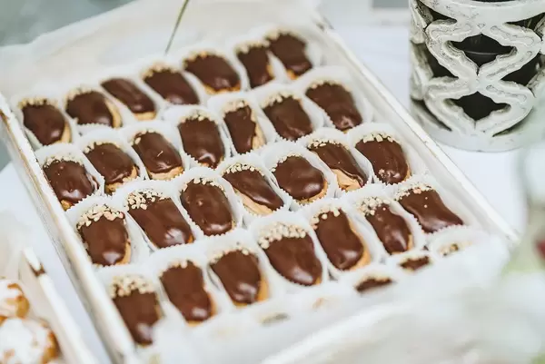 Bunch of ecler pastry covered with chocolate stacked