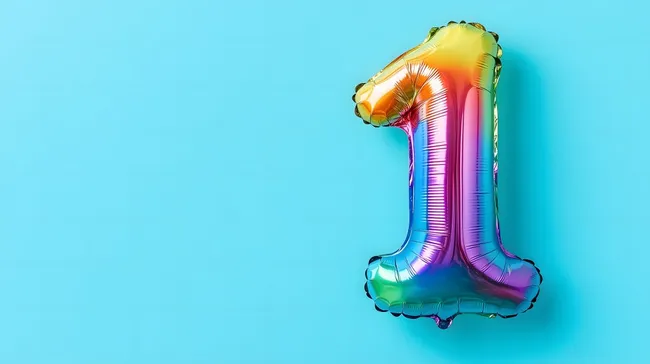 Bunter Nummer-1-Ballon vor türkisem Hintergrund