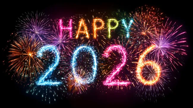 Buntes Silvester-Feuerwerk 2026 vor schwarzem Hintergrund