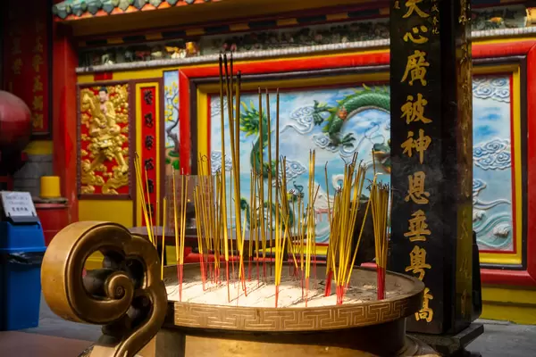 Burning Incense Sticks in a Large Pot with Sand inside the Chinese On Lang Pagoda in Chinatown in Ho Chi Minh City, Vietnam