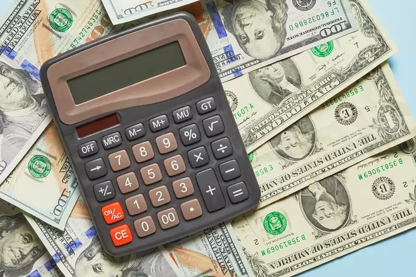 Business concept - calculator on money background