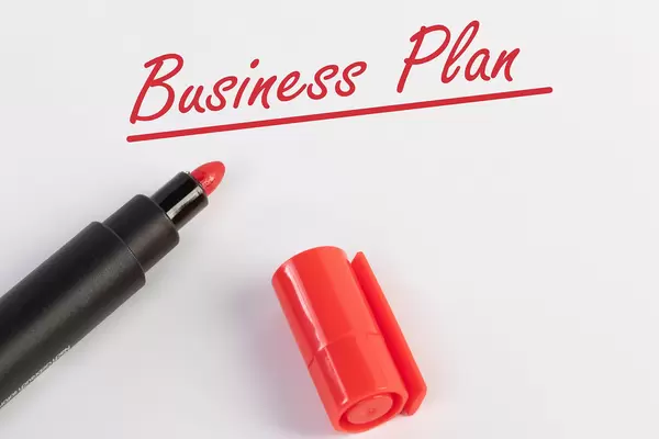Business Plan text with red marker pen