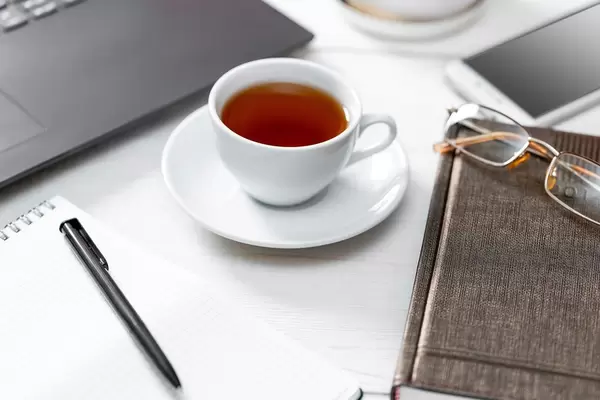 Business table background with a Cup of coffee