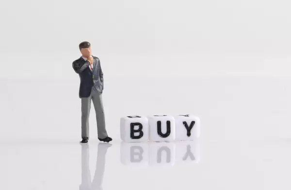 Businessman figure with Buy text