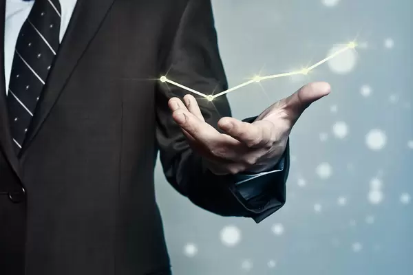 Businessman holding a graph