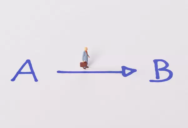 Businessman walking from A to B point