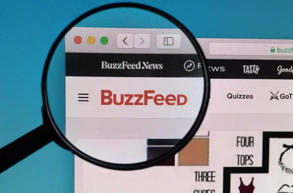 BuzzFeed logo under magnifying glass
