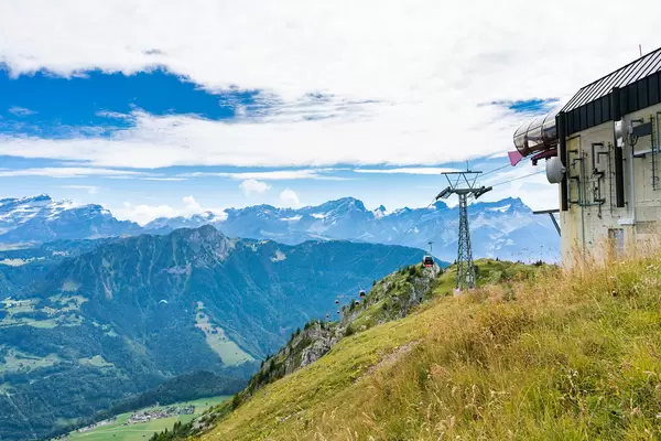 Cable carts goin to and from the station high in Southern Swiss alps