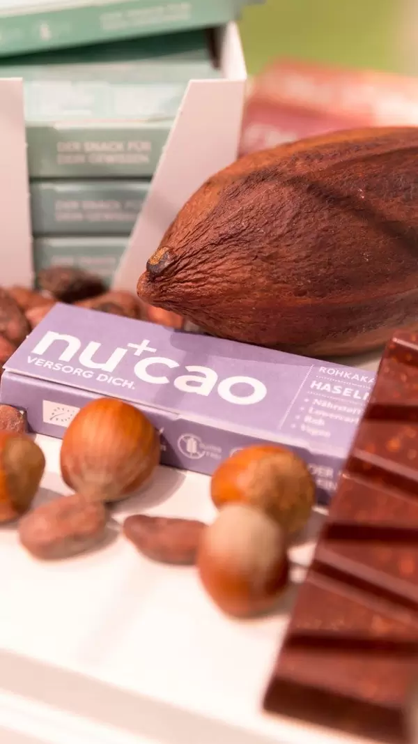 Cacao beans, hazelnuts and Nucao chocolate bar