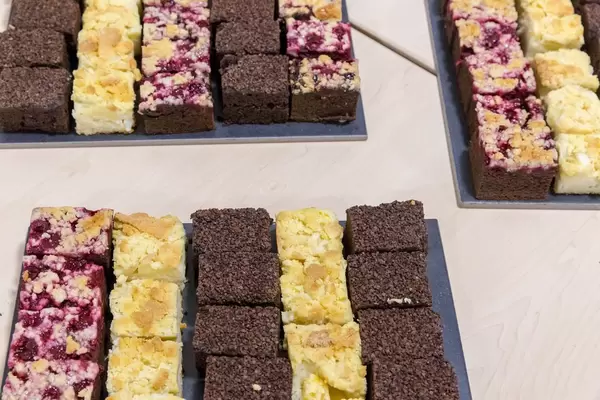 Cake at a buffett - apple pie, plum pie and chocolate cake