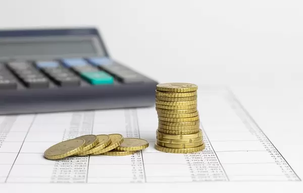 Calculator and gold coins