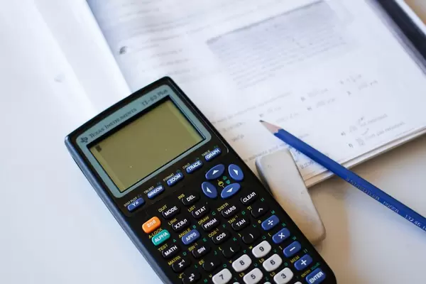 Calculator with Pencil and Eraser  and  paper work