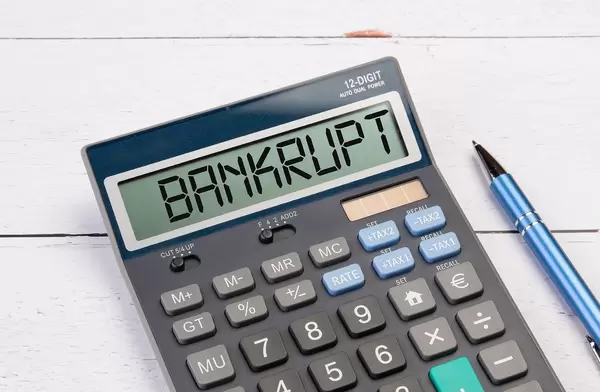Calculator with the word Bankrupt on the display
