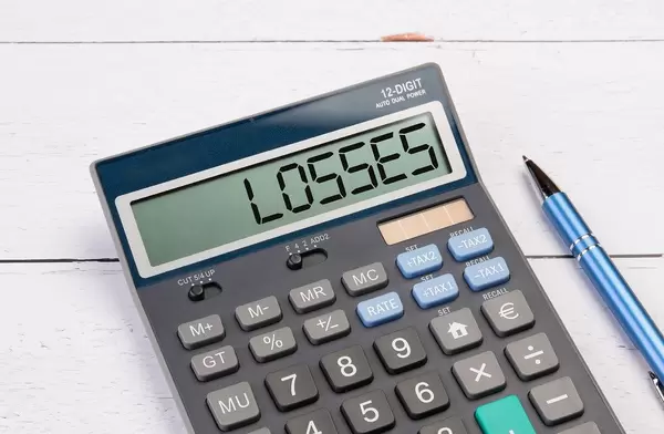 Calculator with the word Losses on the display