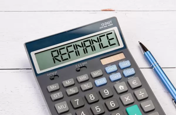Calculator with the word Refinance on the display