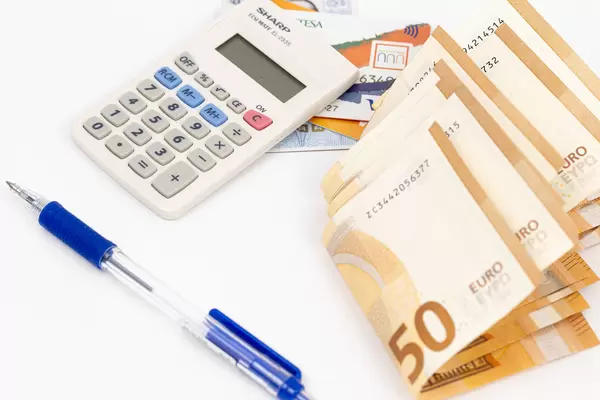 Calculator with Visa cards and Euro currency on the table