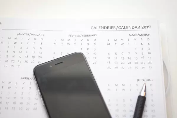 Calendar of 1029 with a smartphone and a pen on a table