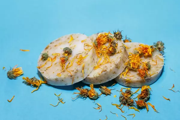 Calendula handmade soap isolated on blue background  Flip 2019