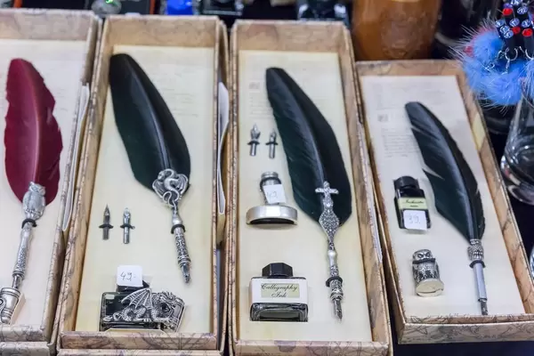 Calligraphy set containing ink and quill