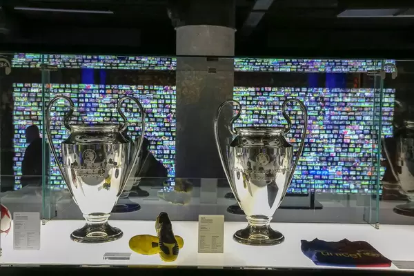 Camp Nou Museum in Spain exhibits trophies from FC Barcelona's winning champions league soccer game of 2015 in Berlin in glass display cabinet