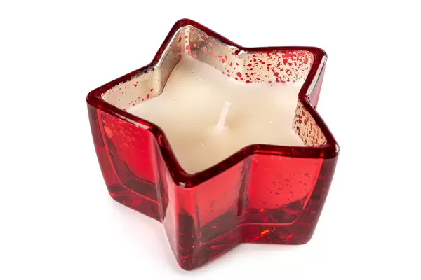 Candlestick in the shape of a star with candle