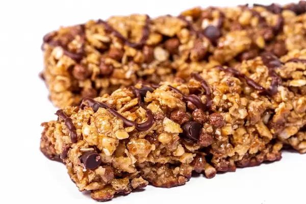 Candy with cereal flakes on white background