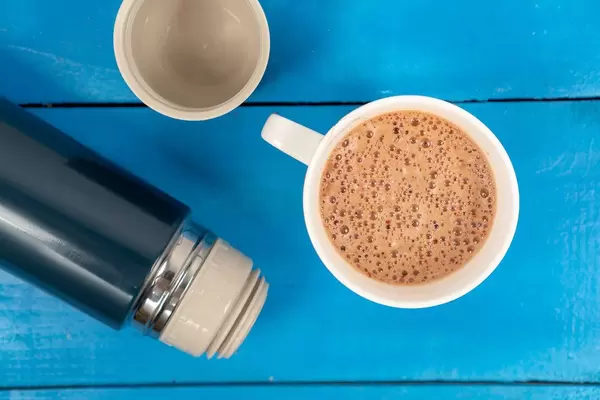 Cappuccino with Thermo Bottle on the wooden board (Flip 2020)