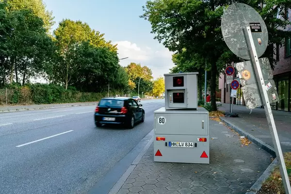 Car has passed portable speed radar box on the side of the street