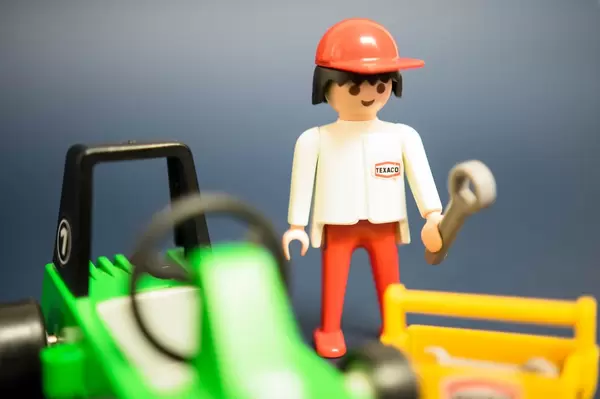 Car mechanic with tools on hand