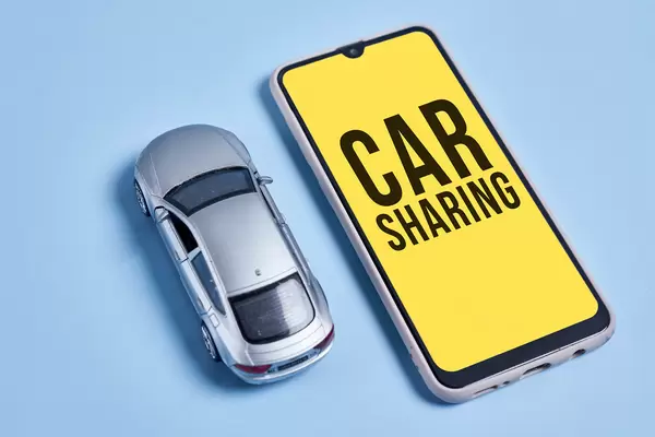 Car sharing concept with car and mobile application
