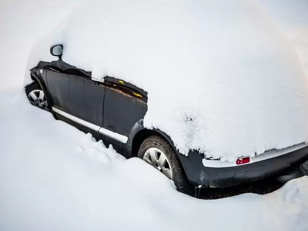 Car stuck in snow after a blizzard