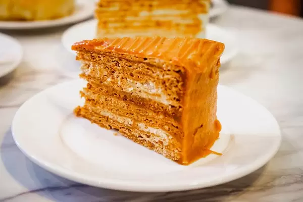 Caramel cake slice on marble table top (Flip 2019)