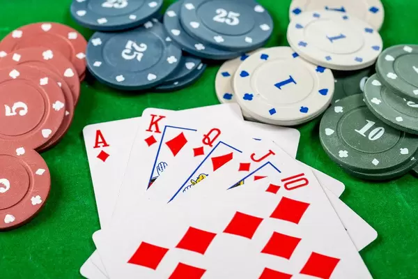 Cards and chips on a green background. Card gambling concept