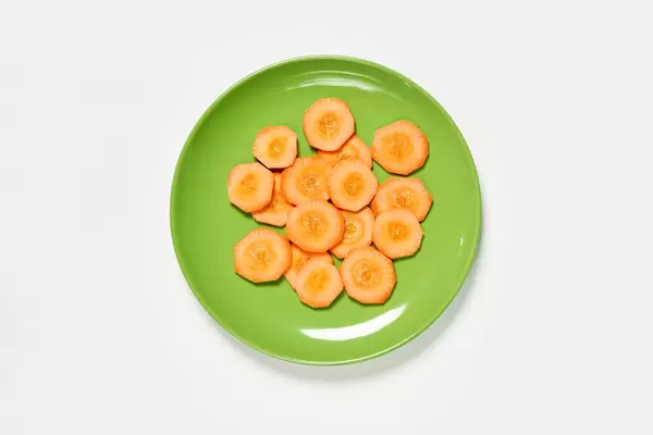 Carrot cuts on green plate