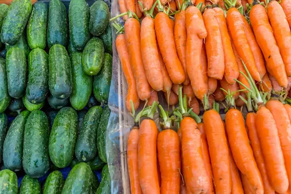 Carrots and cucumbers on marketplace