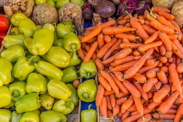 Carrots and paprikas on marketplace