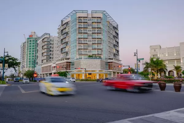 Cars passing by a new hotel in the metro