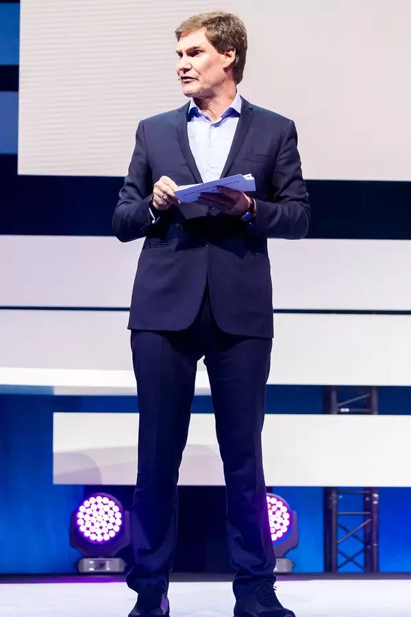 Carsten Maschmeyer self-confident investor on stage of Digital X in Cologne