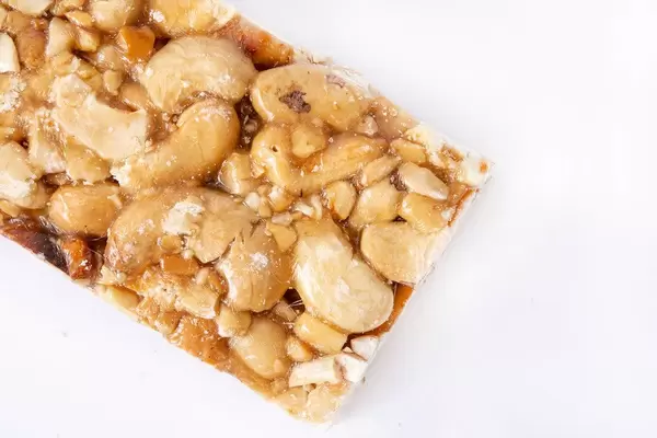 Cashew Bar slice on the white background (Flip 2019)