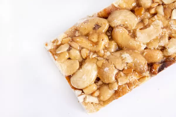 Cashew Bar slice on the white background