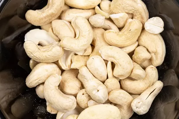 Cashew nuts in the black bowl